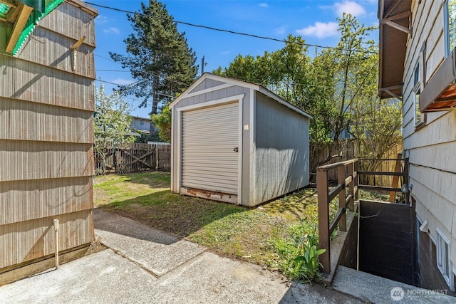 view of shed with a fenced backyard