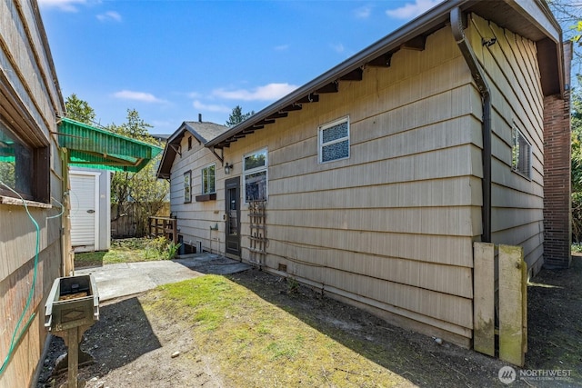 view of property exterior with a patio area