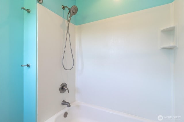bathroom with bathing tub / shower combination