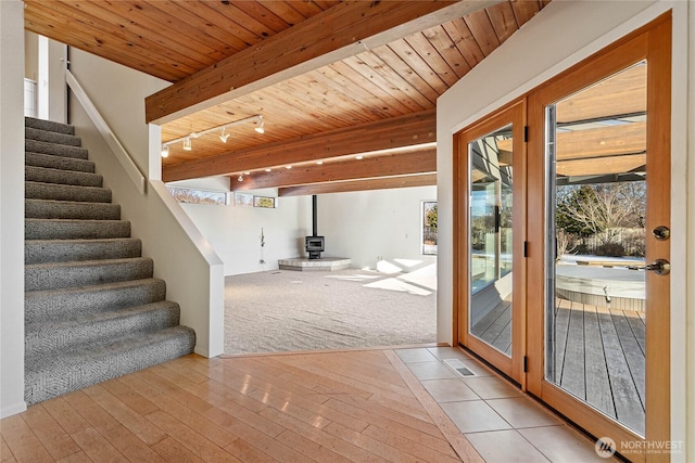 3884 Fort Bellingham Rd, Bellingham, WA 98225 - doorway featuring stairway, a wealth of natural light, a wood stove, and hardwood / wood-style floors