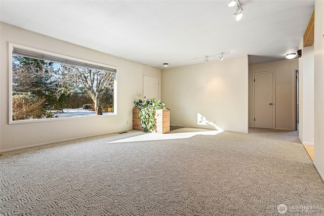 3884 Fort Bellingham Rd, Bellingham, WA 98225 - unfurnished room with rail lighting, carpet flooring, and visible vents