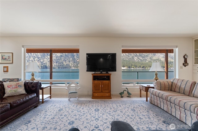 carpeted living room featuring baseboards