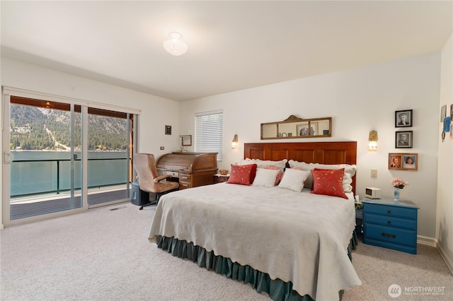 bedroom featuring access to outside, carpet floors, and baseboards