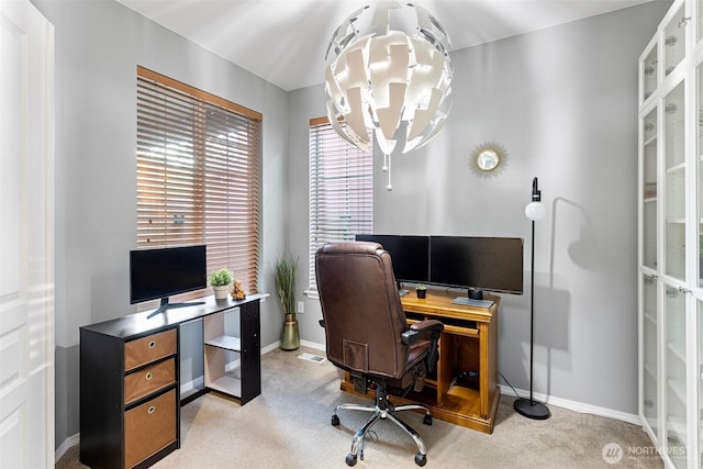 carpeted office featuring baseboards