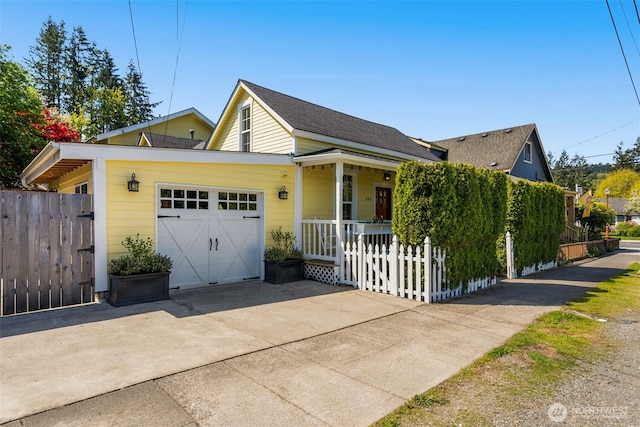 245 SE Bush St, Issaquah, WA 98027 - view of front facade with covered porch, concrete driveway, and an attached garage