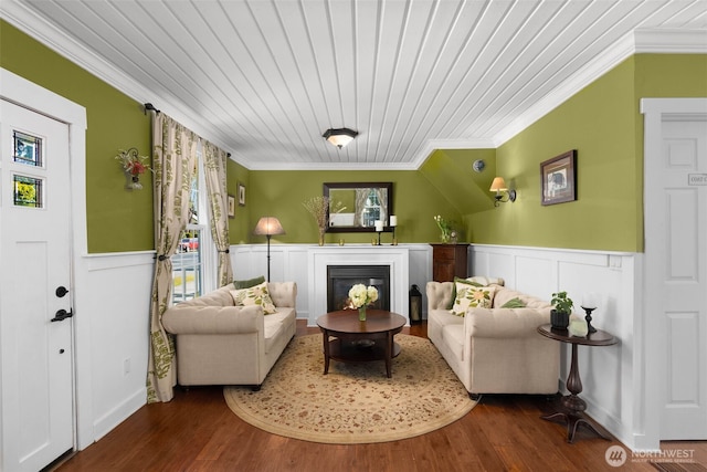 245 SE Bush St, Issaquah, WA 98027 - living room with crown molding, a glass covered fireplace, wainscoting, wood finished floors, and wooden ceiling