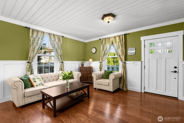 245 SE Bush St, Issaquah, WA 98027 - living room featuring crown molding, wainscoting, a decorative wall, and hardwood / wood-style floors