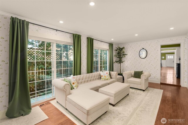 245 SE Bush St, Issaquah, WA 98027 - living room with crown molding, wallpapered walls, wood finished floors, recessed lighting, and baseboards