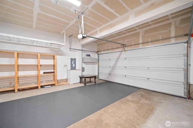garage featuring a garage door opener and electric panel