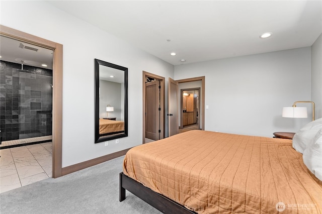 bedroom featuring recessed lighting, marble finish floors, baseboards, and ensuite bathroom
