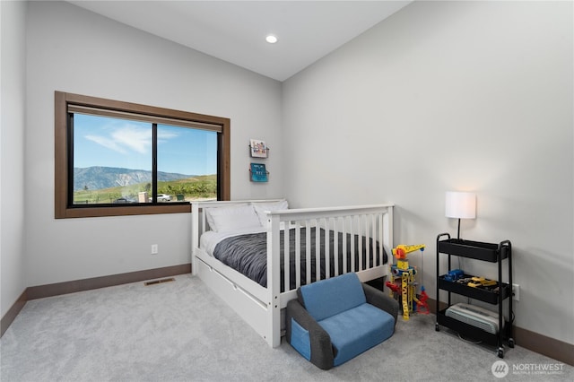 carpeted bedroom with baseboards and recessed lighting
