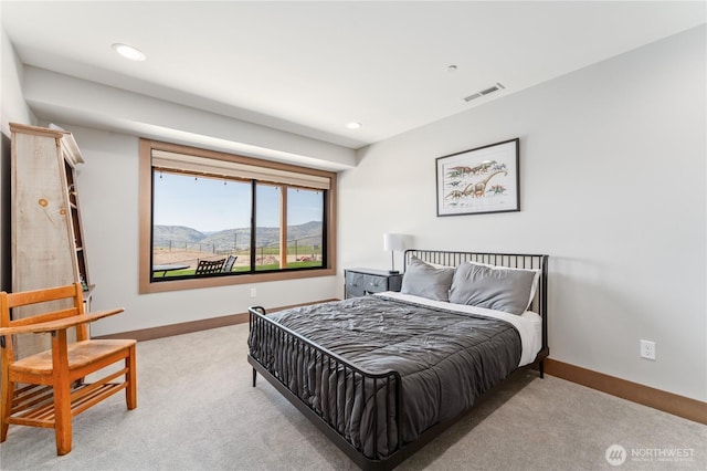 bedroom featuring carpet flooring, baseboards, a mountain view, and recessed lighting