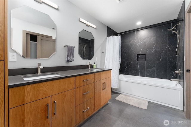bathroom featuring shower / bathtub combination with curtain, finished concrete flooring, and double vanity