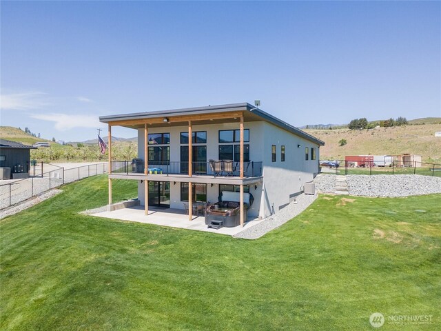 back of property with a patio area and stucco siding