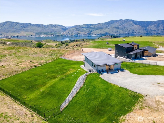 view of subject property with a water and mountain view