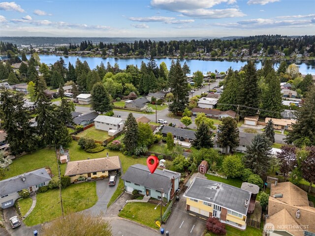 aerial view featuring a water view and a residential view