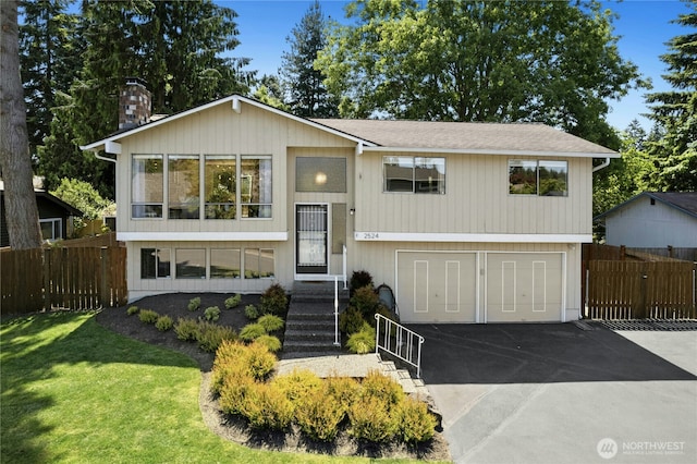 2524 171st St SE, Bothell, WA 98012 - raised ranch with driveway, an attached garage, and a chimney