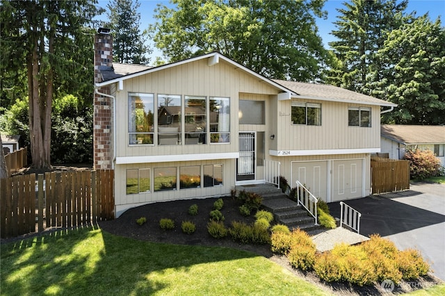 2524 171st St SE, Bothell, WA 98012 - raised ranch featuring a chimney and roof with shingles