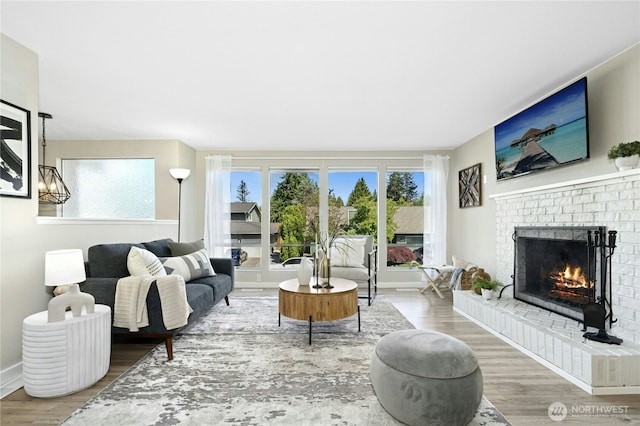 2524 171st St SE, Bothell, WA 98012 - living area featuring a fireplace, wood finished floors, and baseboards
