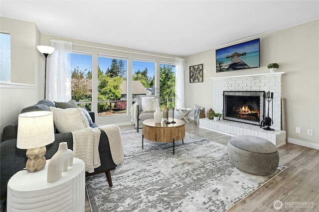 2524 171st St SE, Bothell, WA 98012 - living room with wood finished floors, a fireplace, and baseboards