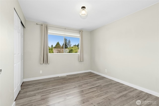 2524 171st St SE, Bothell, WA 98012 - unfurnished bedroom with wood finished floors, baseboards, and a closet