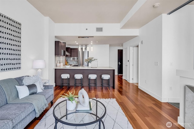 737 Olive Way Unit 3101, Seattle, WA 98101 - living room with wood finished floors and baseboards