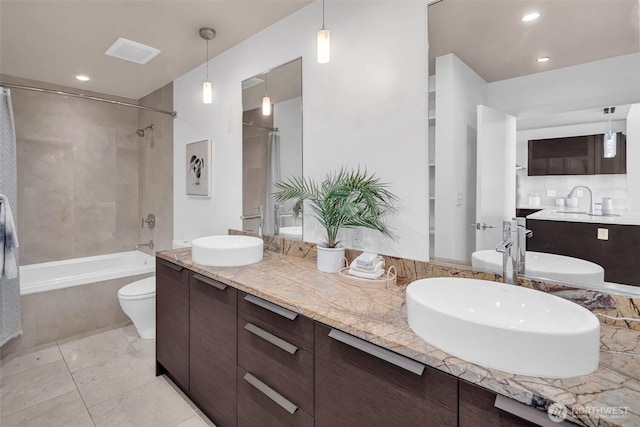 737 Olive Way Unit 3101, Seattle, WA 98101 - bathroom with shower / tub combo, double vanity, toilet, and recessed lighting