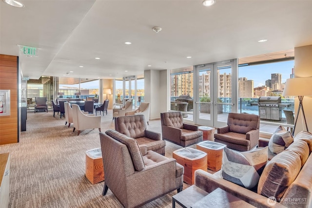 737 Olive Way Unit 3101, Seattle, WA 98101 - carpeted living room featuring recessed lighting, a wall of windows, and a city view