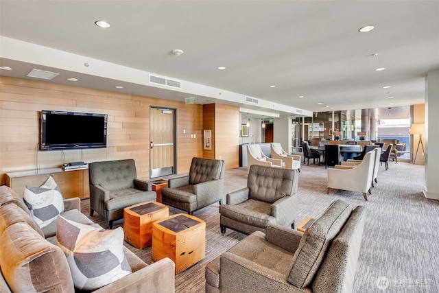 737 Olive Way Unit 3101, Seattle, WA 98101 - living room featuring recessed lighting, light colored carpet, and wooden walls