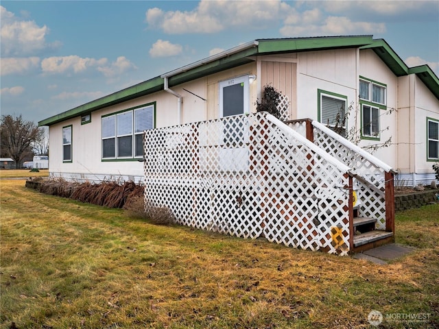 view of property exterior featuring a yard