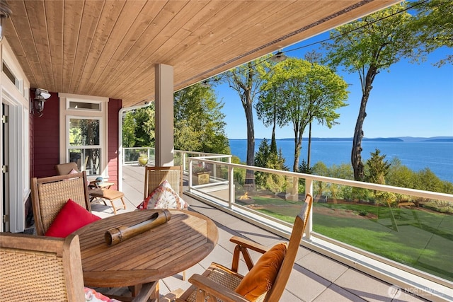 balcony featuring a water view