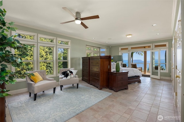 bedroom featuring baseboards, access to outside, ornamental molding, and a water view