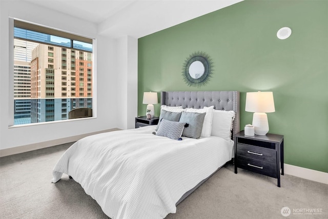 bedroom with carpet floors and baseboards