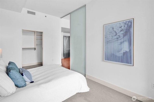 bedroom featuring a closet and carpet