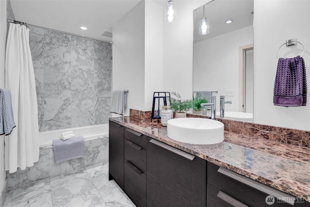 bathroom with marble finish flooring, vanity, and recessed lighting