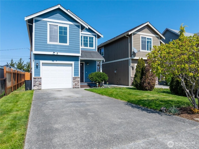 craftsman-style home with fence, stone siding, a front yard, and a garage