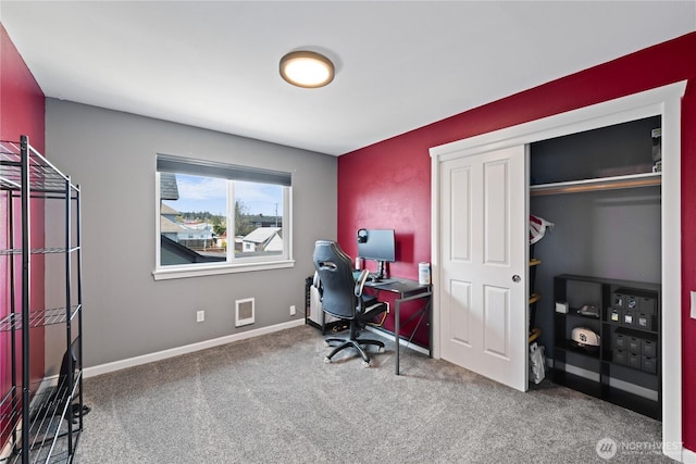 office featuring baseboards, carpet flooring, and visible vents