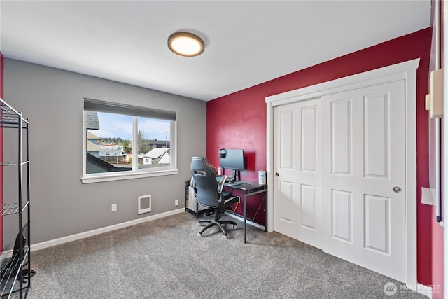 carpeted home office with baseboards and visible vents
