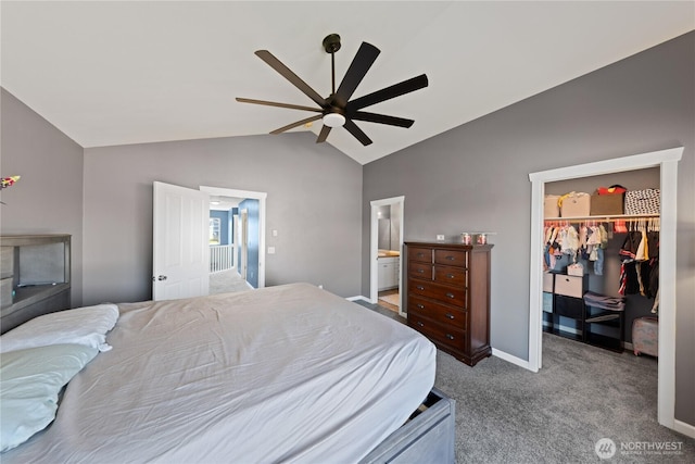 carpeted bedroom featuring vaulted ceiling, a ceiling fan, a closet, a spacious closet, and connected bathroom