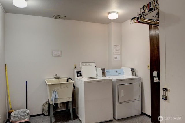 6110 24th Ave NW Unit 203, Seattle, WA 98107 - shared laundry room with independent washer and dryer and baseboards