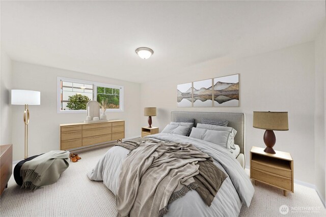 bedroom featuring baseboards and light carpet
