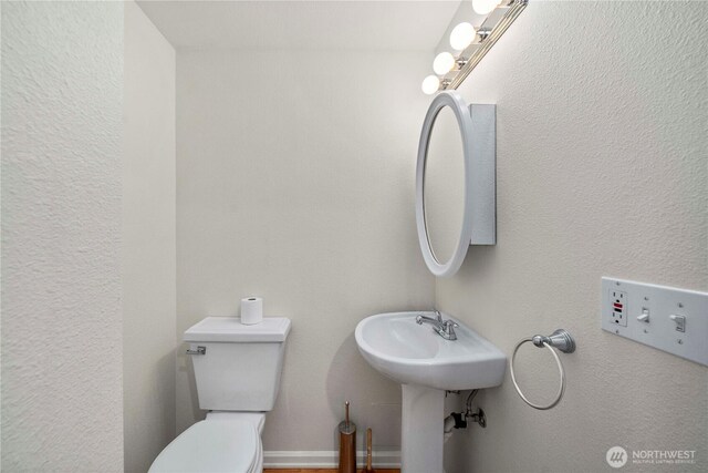 half bathroom with toilet