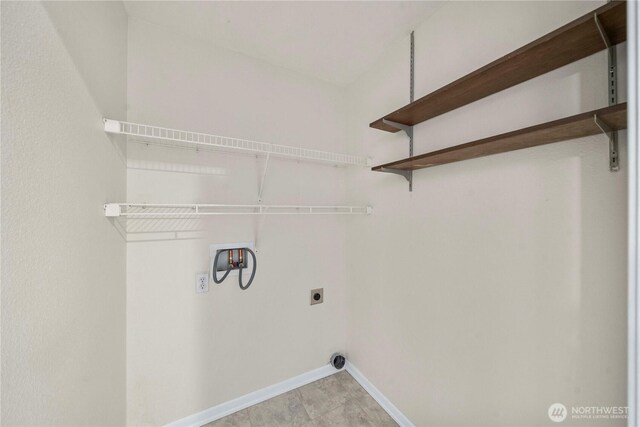 washroom with laundry area, hookup for a washing machine, baseboards, and hookup for an electric dryer