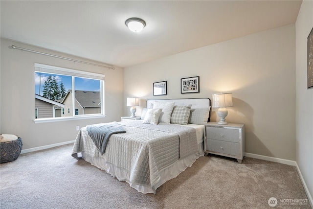 carpeted bedroom with baseboards