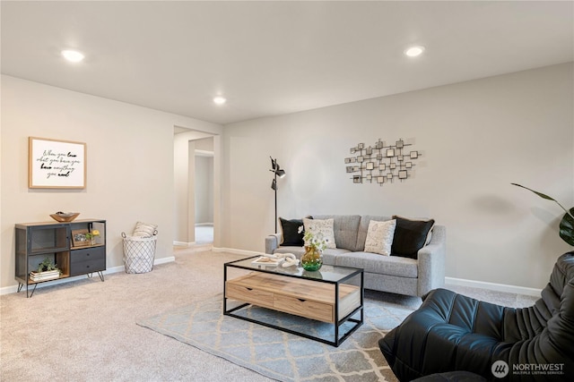 living area with carpet floors, baseboards, and recessed lighting