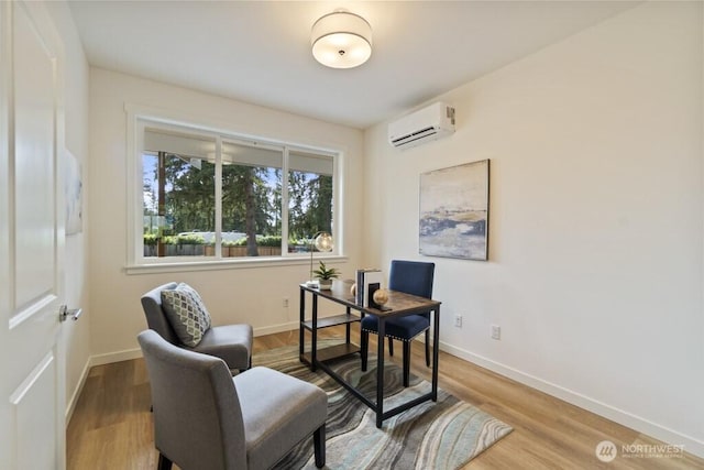 16106 Broadway Ave, Snohomish, WA 98296 - home office with a wall mounted AC, wood finished floors, and baseboards