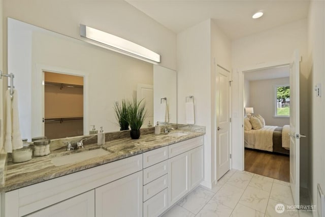 16106 Broadway Ave, Snohomish, WA 98296 - ensuite bathroom with marble look tiles, double vanity, and recessed lighting