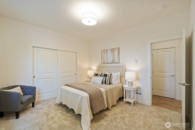 16106 Broadway Ave, Snohomish, WA 98296 - bedroom with a closet, light carpet, and baseboards