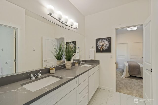 16106 Broadway Ave, Snohomish, WA 98296 - full bathroom with double vanity, marble finish floors, ensuite bathroom, and baseboards