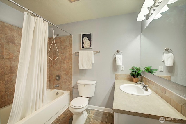 full bath featuring vanity, baseboards, shower / bath combo with shower curtain, and toilet